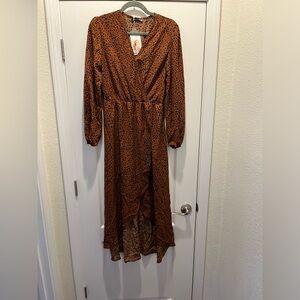 Never worn! Rust colored with black polka dots. long sleeve knee length dress!